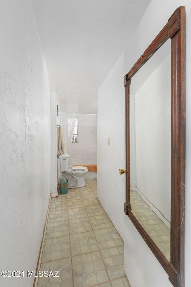 bathroom with tile patterned floors and toilet