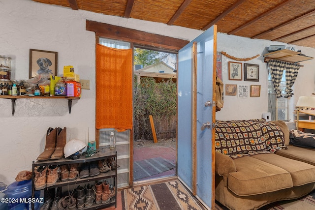 entryway featuring beam ceiling and wood ceiling