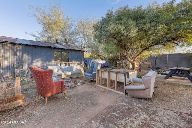 view of patio with an outbuilding