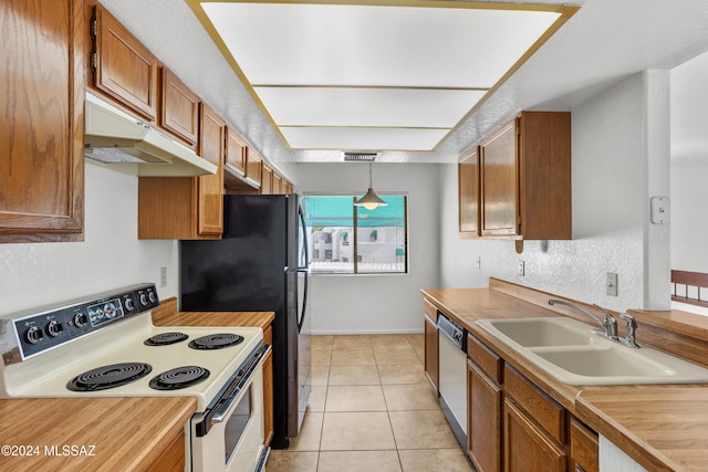 kitchen with sink, light tile patterned floors, dishwasher, white range with electric cooktop, and hanging light fixtures