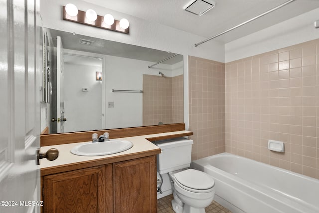 full bathroom featuring vanity, tiled shower / bath combo, a textured ceiling, tile patterned flooring, and toilet