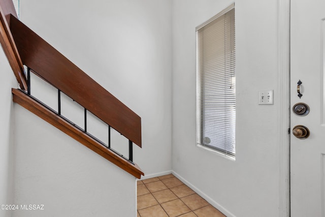 staircase with tile patterned floors