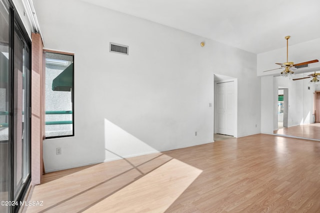 unfurnished living room with ceiling fan and light wood-type flooring