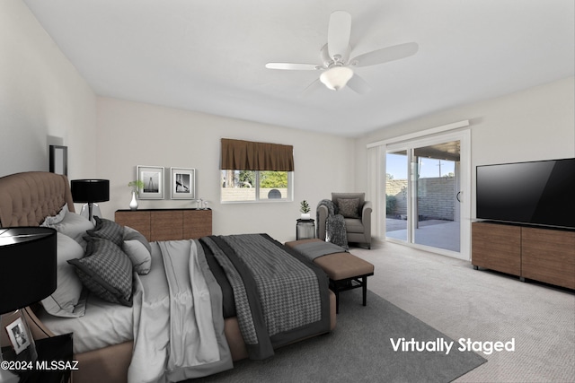 carpeted bedroom featuring access to outside and ceiling fan