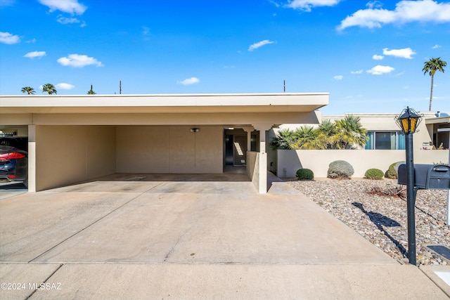 view of front facade with a carport