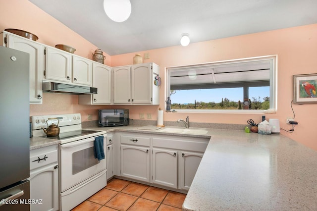 kitchen with white range with electric cooktop, stainless steel fridge, white cabinetry, and sink