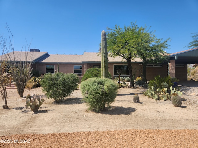 single story home with a carport