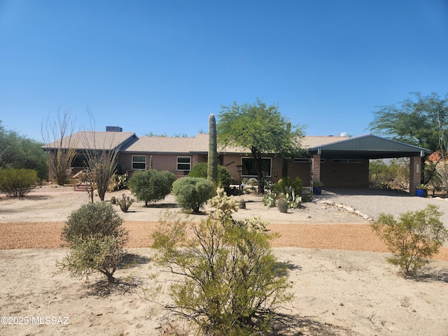 ranch-style house with a carport