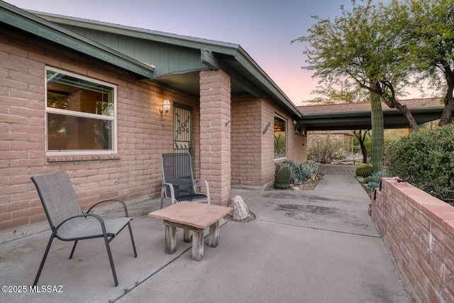 view of patio terrace at dusk