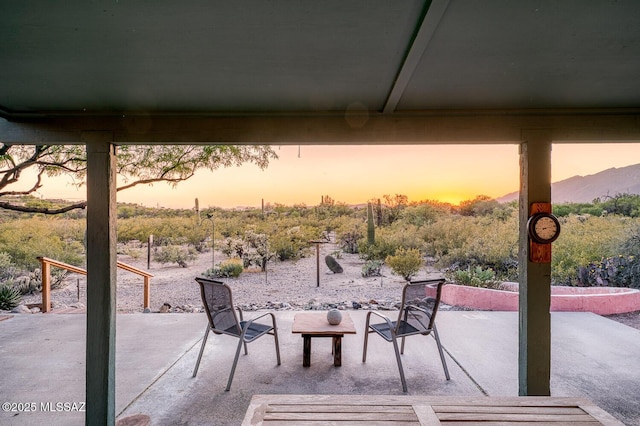 view of patio terrace at dusk