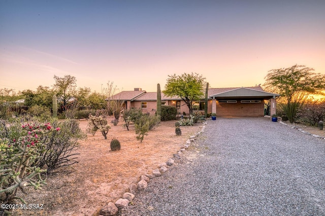 single story home featuring a carport