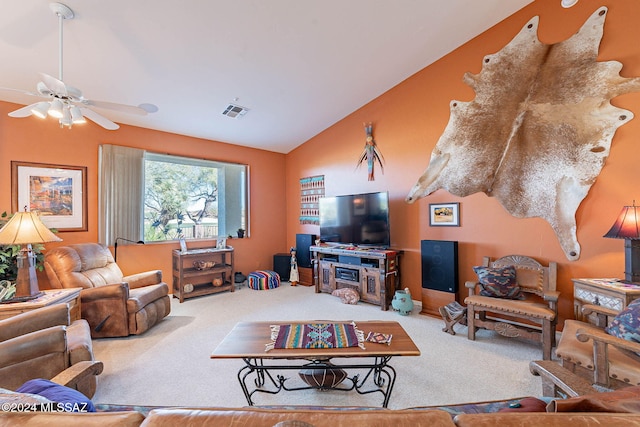 living area with carpet floors, visible vents, a ceiling fan, and lofted ceiling