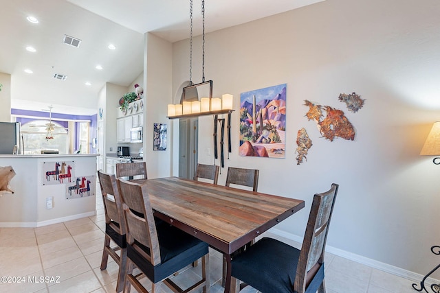 dining area featuring light tile patterned floors, visible vents, vaulted ceiling, and recessed lighting