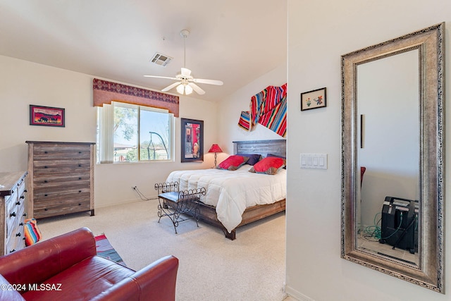 bedroom with baseboards, carpet, visible vents, and a ceiling fan