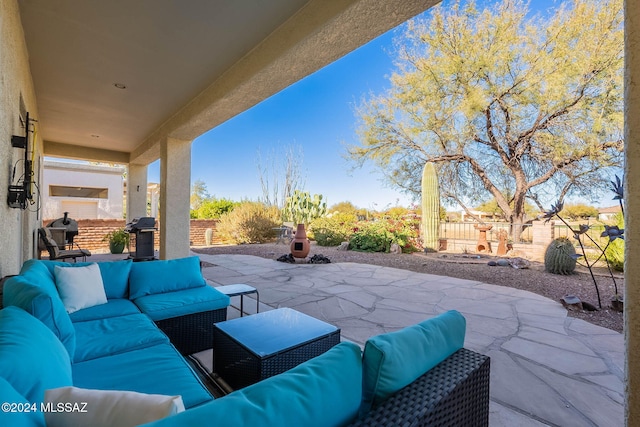 view of patio / terrace with an outdoor hangout area, grilling area, and fence private yard