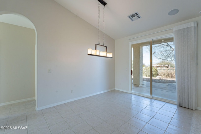 unfurnished room featuring arched walkways, light tile patterned floors, vaulted ceiling, and visible vents