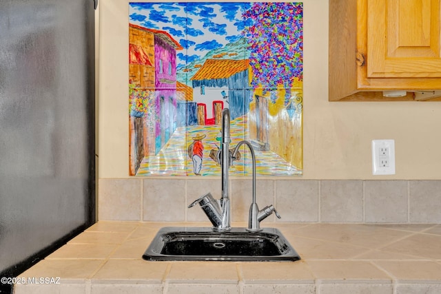 interior details featuring sink and light brown cabinets