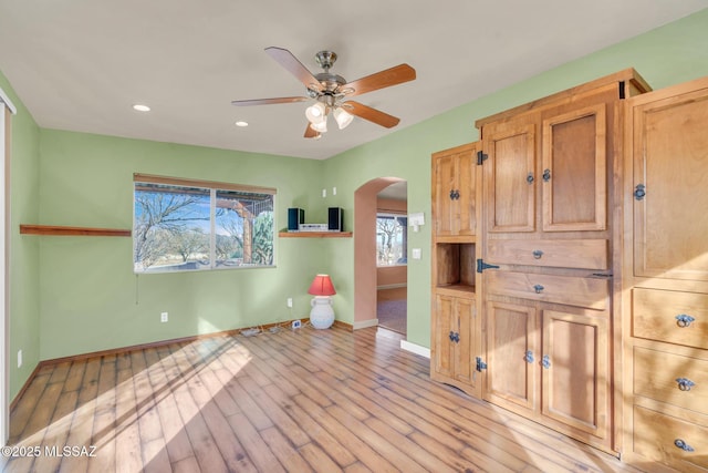 interior space featuring ceiling fan and light wood-type flooring