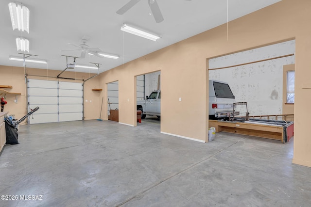 garage featuring a garage door opener and ceiling fan