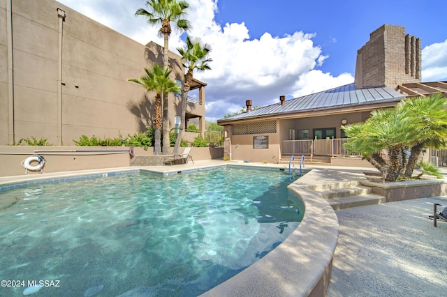 view of swimming pool featuring a patio