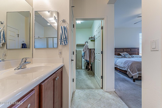 bathroom with tile patterned flooring and vanity