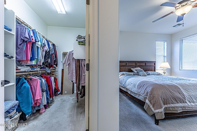 carpeted bedroom with ceiling fan