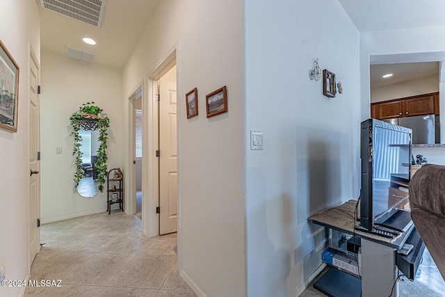 hallway with light tile patterned floors