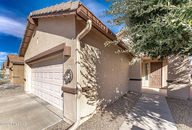 view of side of property with a garage