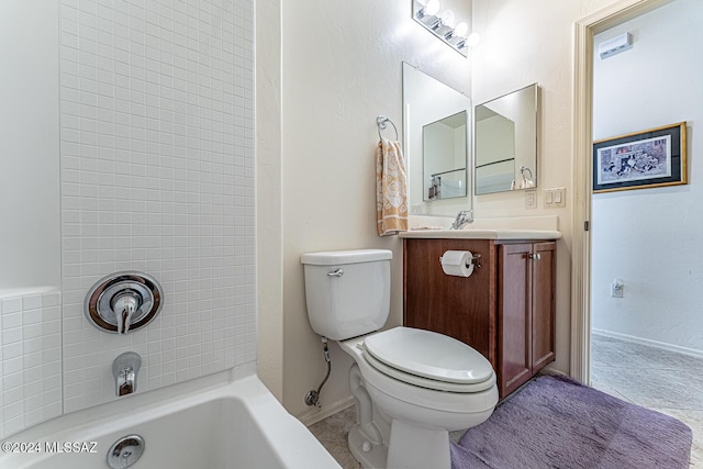 bathroom featuring tile patterned flooring, vanity, and toilet