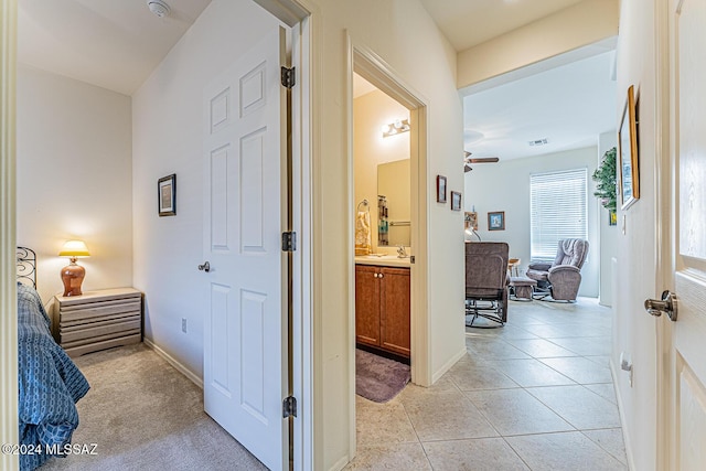 hallway featuring light tile patterned floors