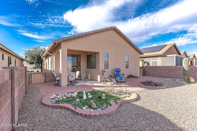 rear view of house featuring a patio