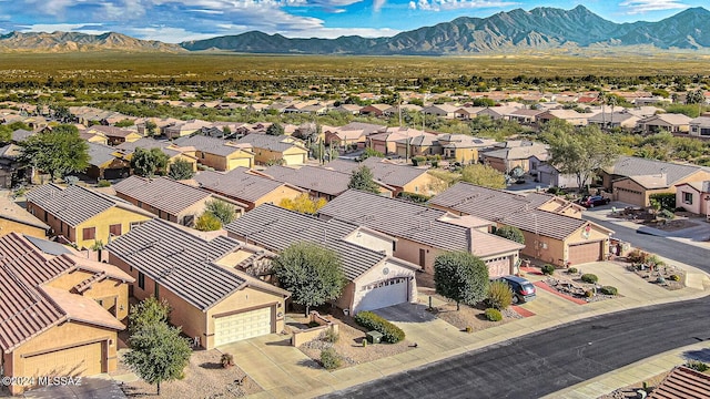 birds eye view of property featuring a mountain view