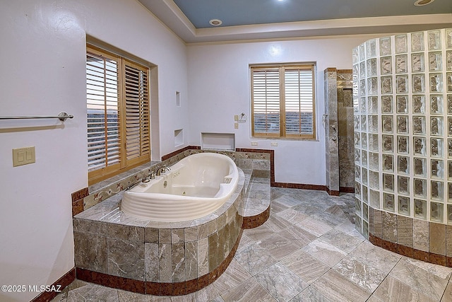 bathroom featuring separate shower and tub