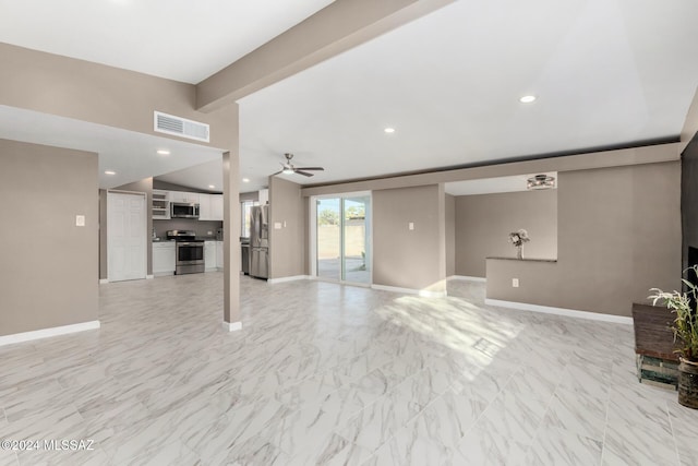 living room with ceiling fan and beam ceiling