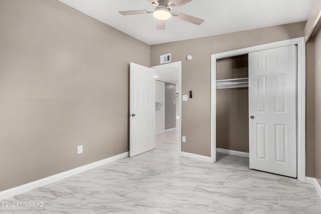 unfurnished bedroom featuring ceiling fan and a closet