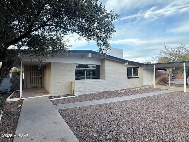 view of front of home with a carport