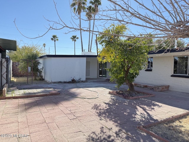 rear view of property with a patio area