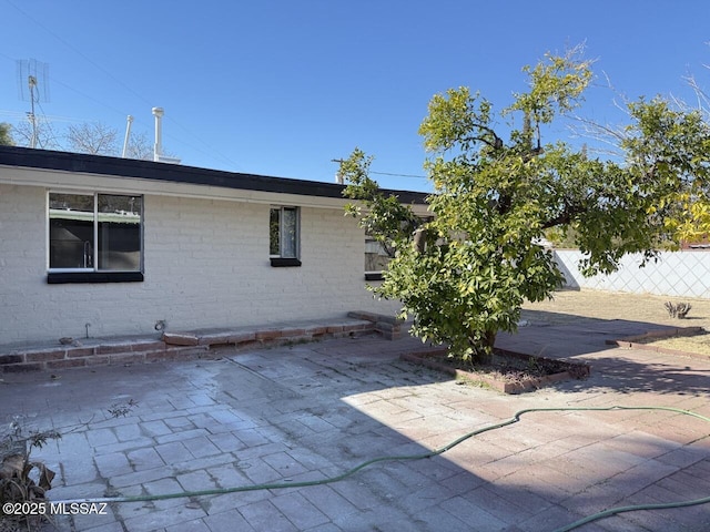 view of property exterior featuring a patio