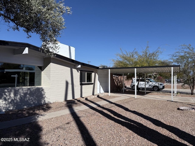 view of home's exterior with a carport