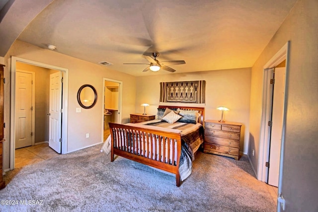 bedroom with carpet flooring, a ceiling fan, visible vents, and baseboards