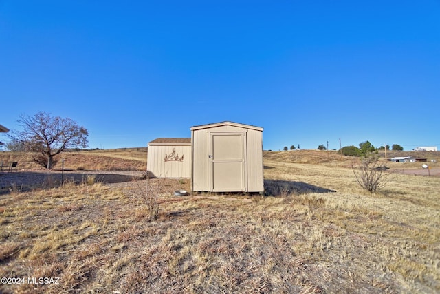 view of shed featuring a rural view