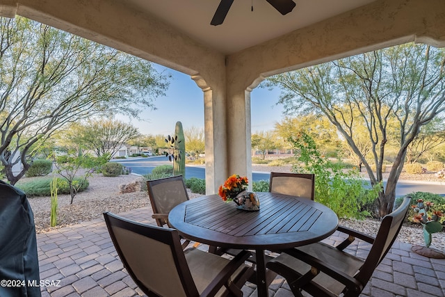 view of patio featuring outdoor dining space and ceiling fan