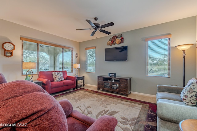 living room with a wealth of natural light and ceiling fan