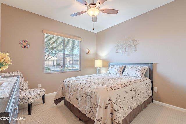 bedroom featuring ceiling fan and light colored carpet