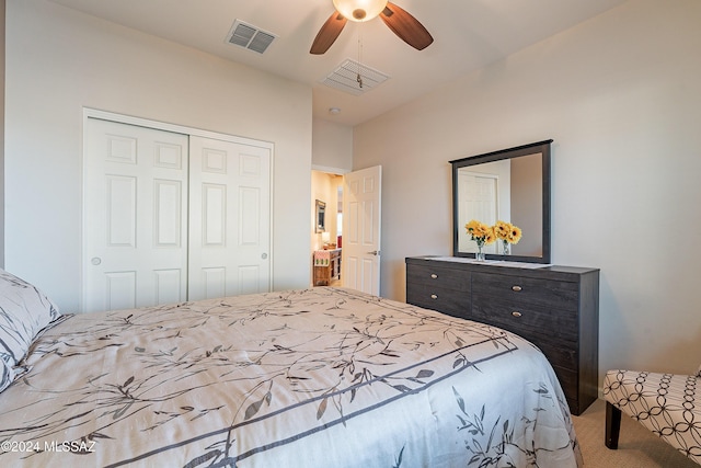 carpeted bedroom with ceiling fan and a closet