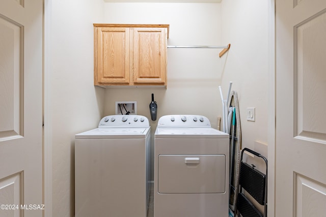 laundry room with cabinets and independent washer and dryer