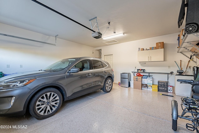 garage featuring a garage door opener