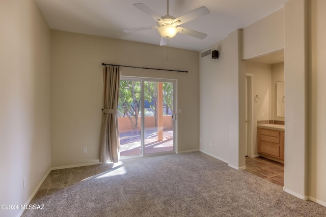 empty room with light carpet, ceiling fan, and baseboards