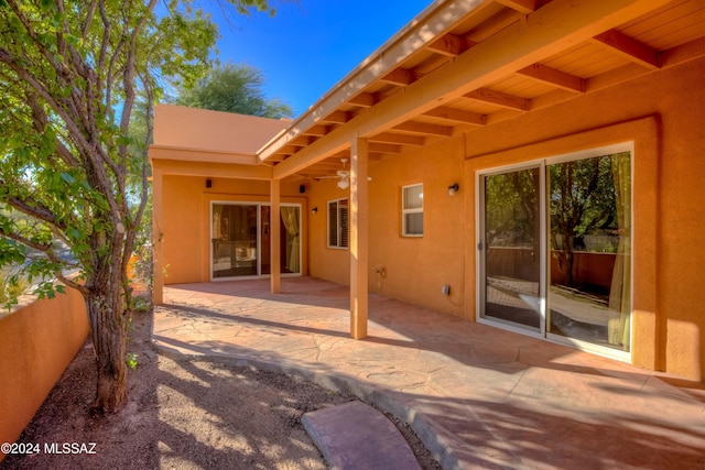 view of patio / terrace featuring fence and ceiling fan