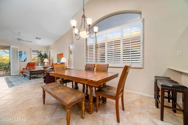 63506 E Harmony Dr, Tucson, AZ 85739 - tiled dining space featuring ceiling fan with notable chandelier and lofted ceiling